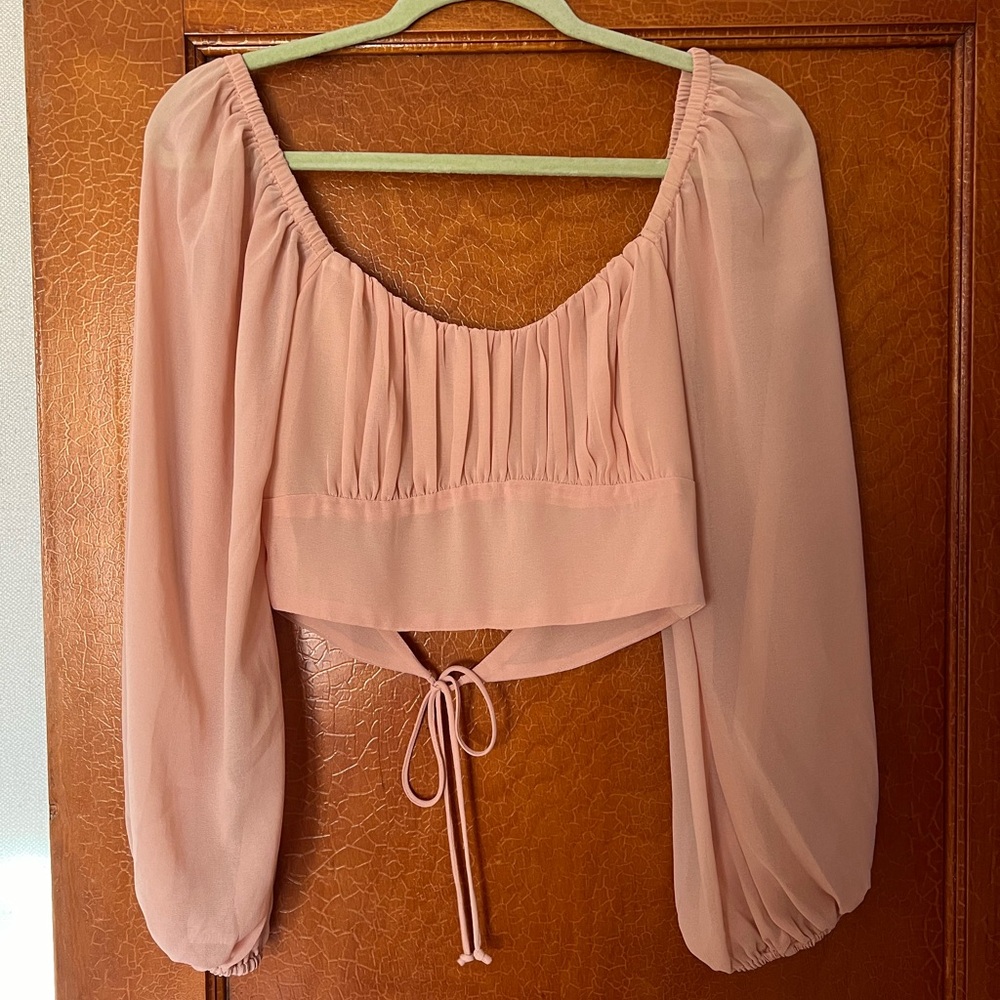 Pink open back long sleeve shirt